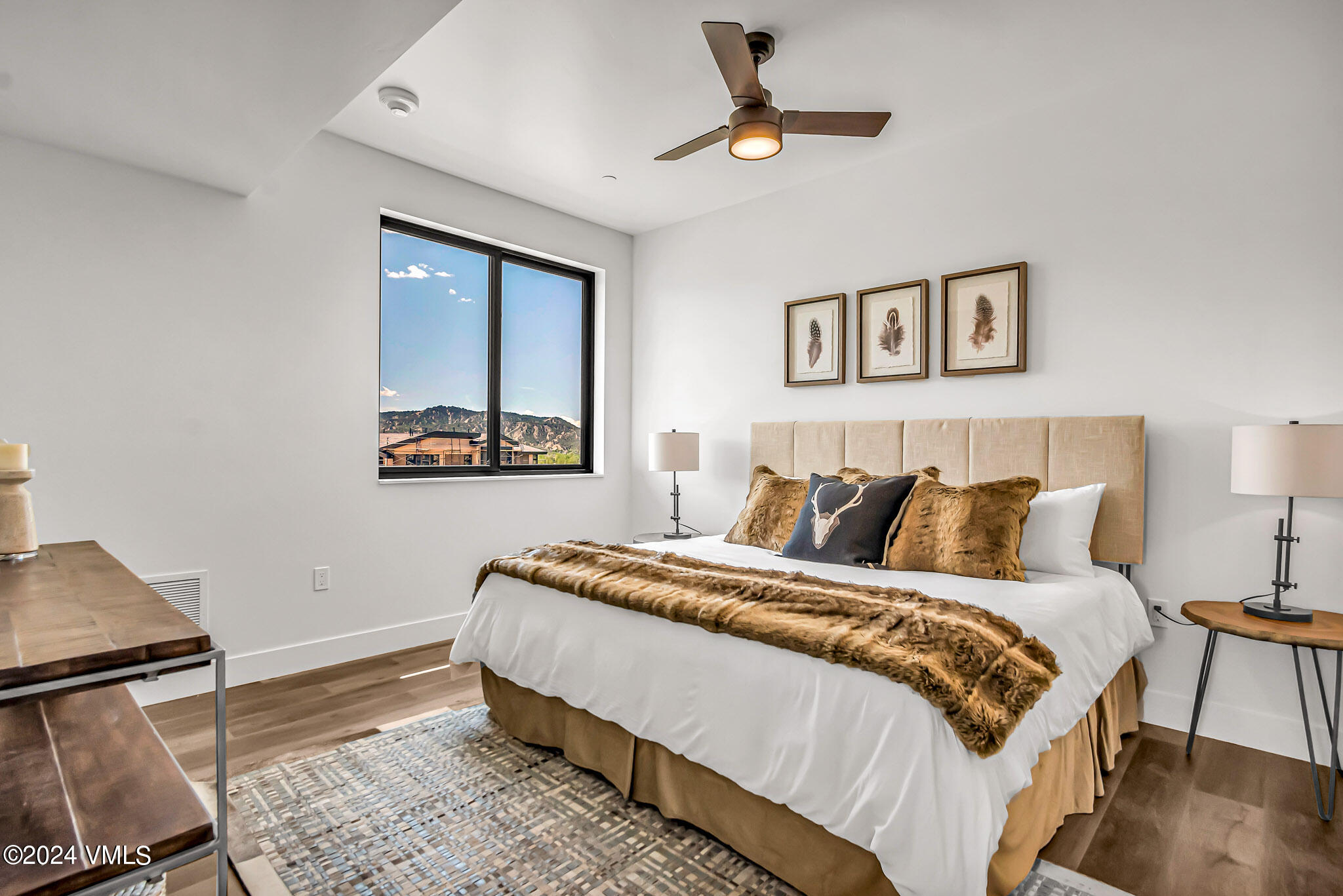 91 Mount Hope Circle, Unit A304 Eagle, CO 81631 - Photo 5 of 8 a bedroom with a large bed and a window