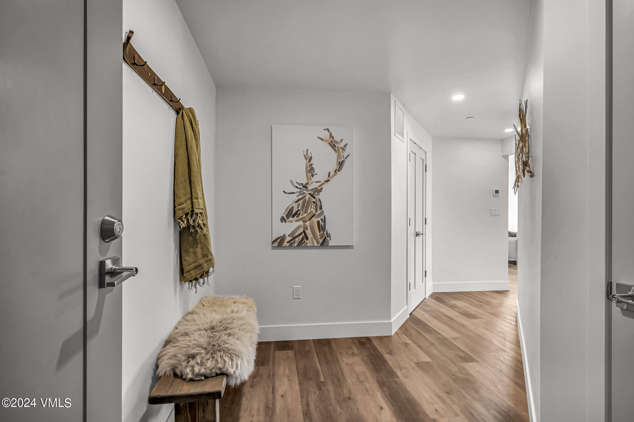 91 Mount Hope Circle, Unit A304 Eagle, CO 81631 - Photo 7 of 8 a view of room with furniture and wooden floor