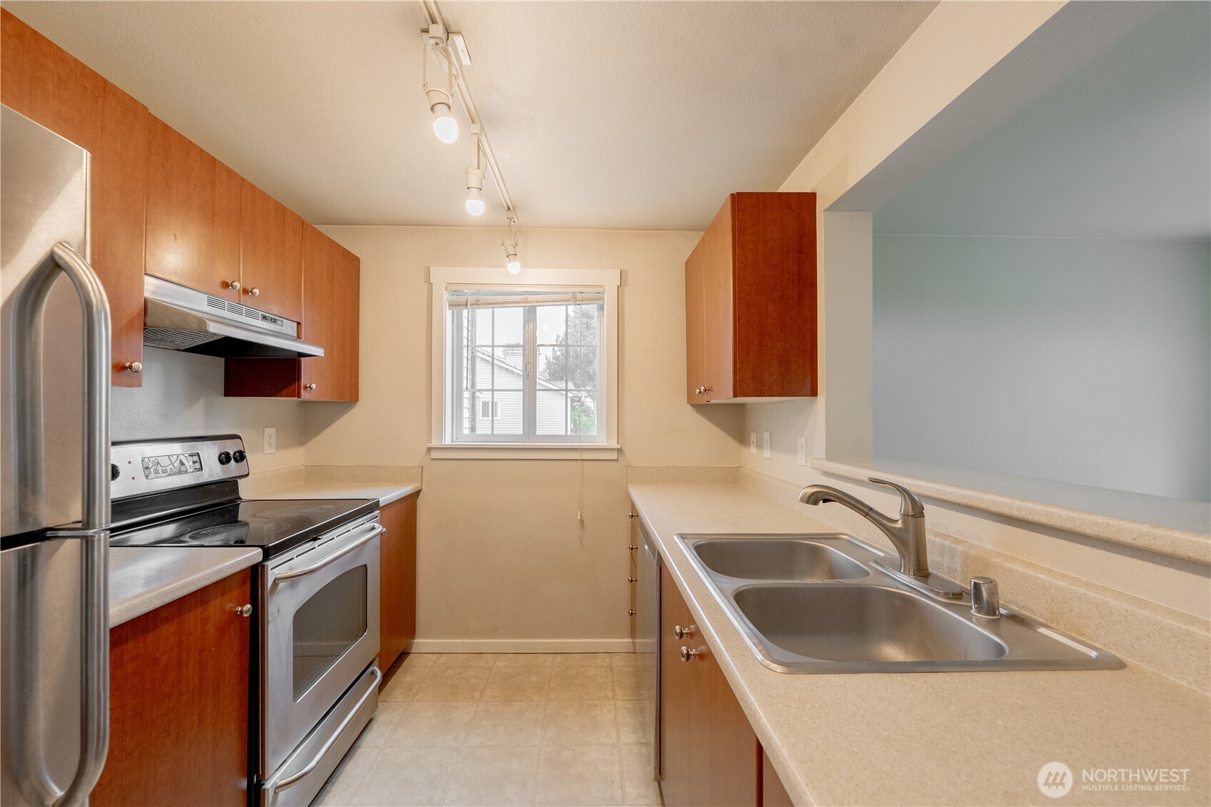12404 East Gibson Road, Unit Q201 Everett, WA 98204 - Photo 12 of 40 a kitchen that has a sink and a stove top oven