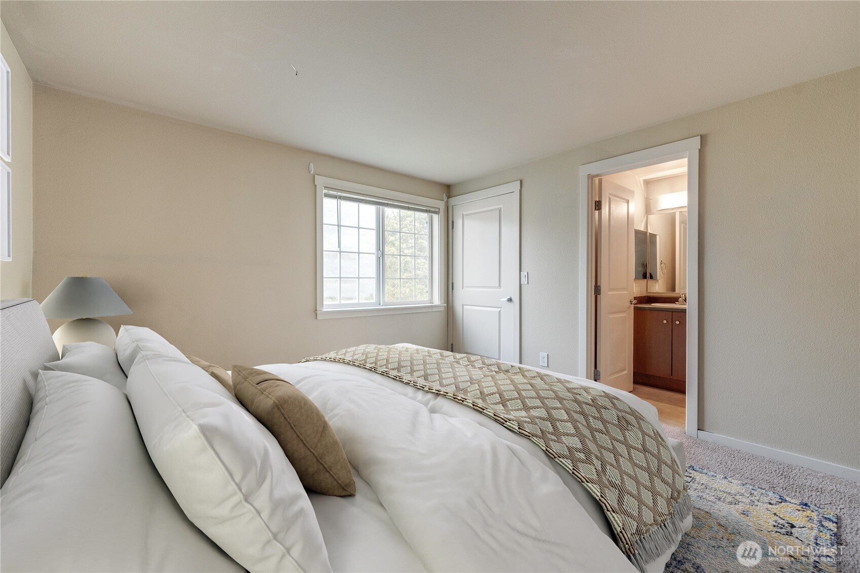 12404 East Gibson Road, Unit Q201 Everett, WA 98204 - Photo 17 of 40 a bedroom with a bed and a window