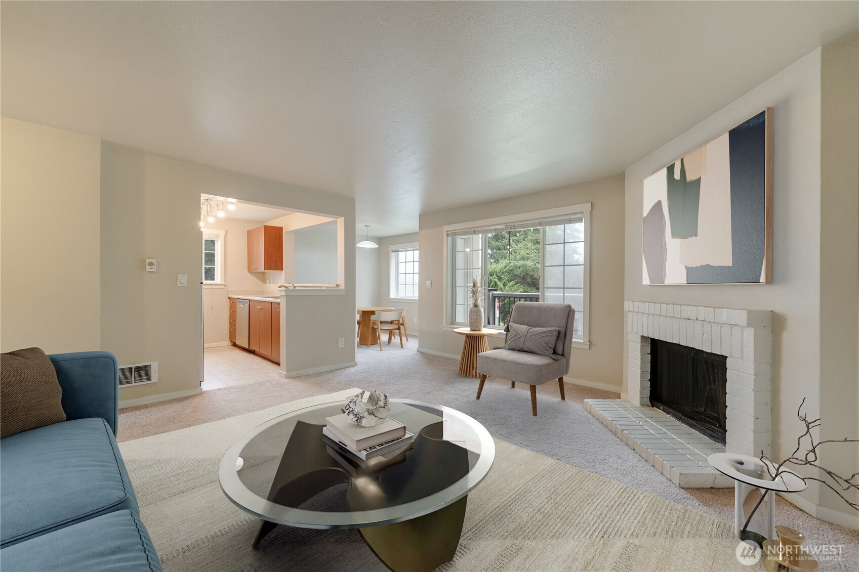 12404 East Gibson Road, Unit Q201 Everett, WA 98204 - Photo 2 of 40 a living room with furniture and a fireplace