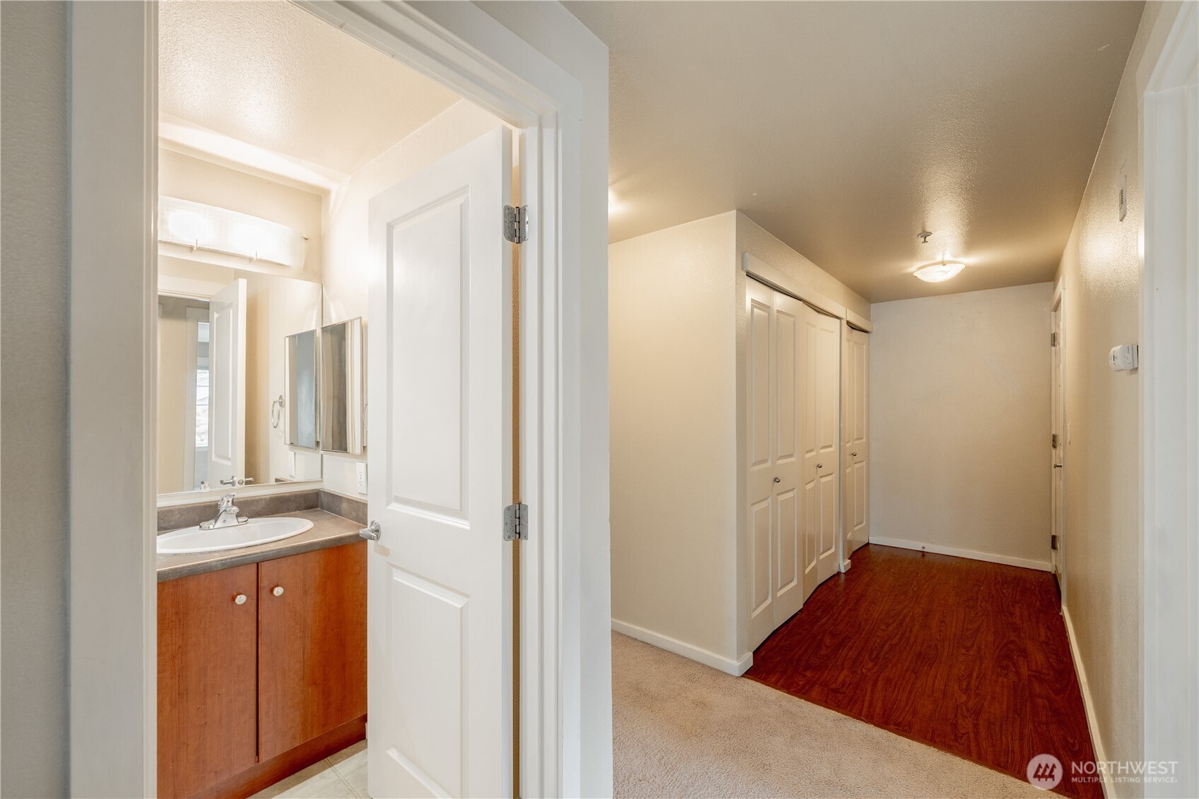 12404 East Gibson Road, Unit Q201 Everett, WA 98204 - Photo 25 of 40 a bathroom with a sink and a mirror