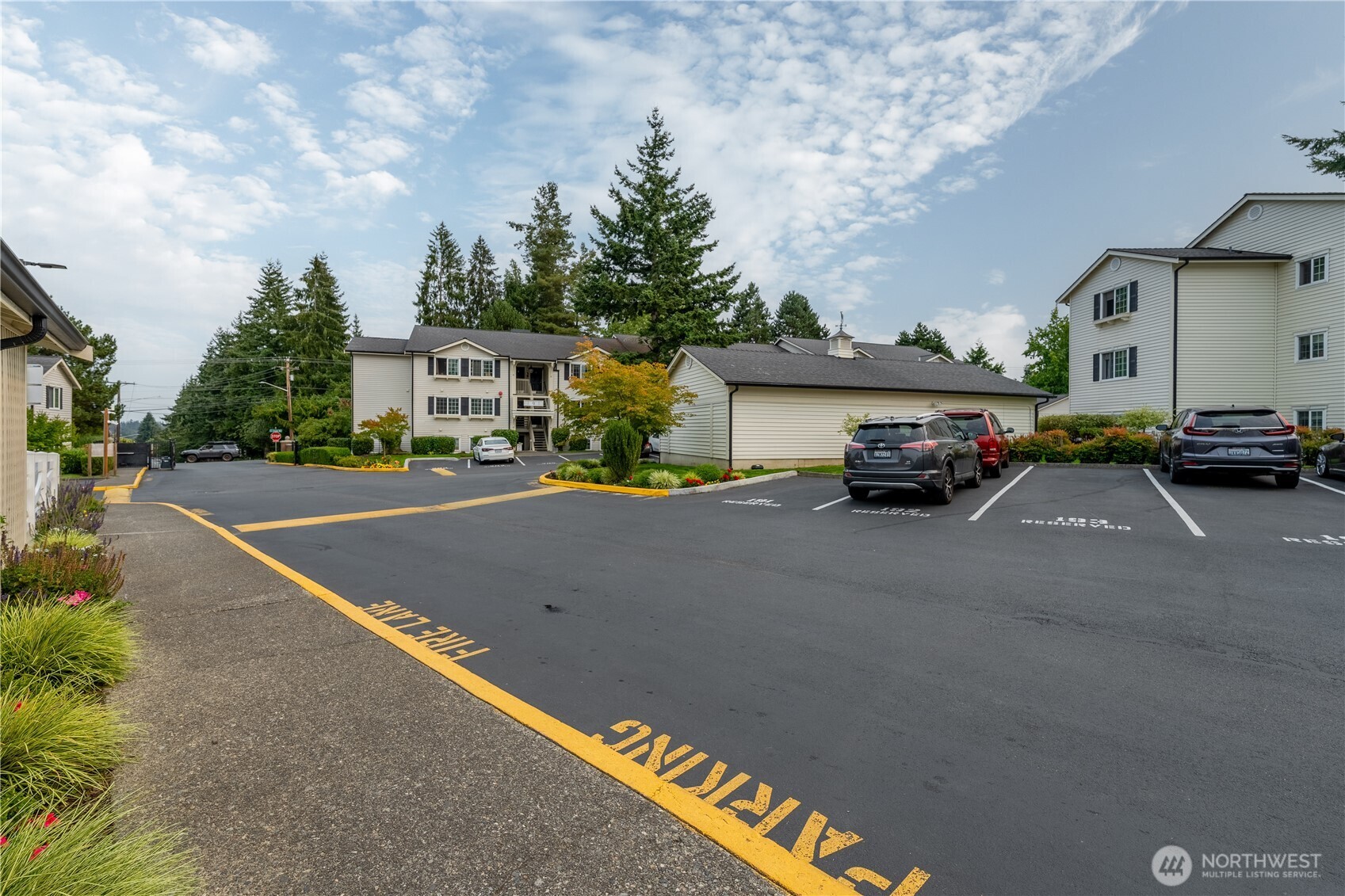 12404 East Gibson Road, Unit Q201 Everett, WA 98204 - Photo 32 of 40 a car parked on the side of the road