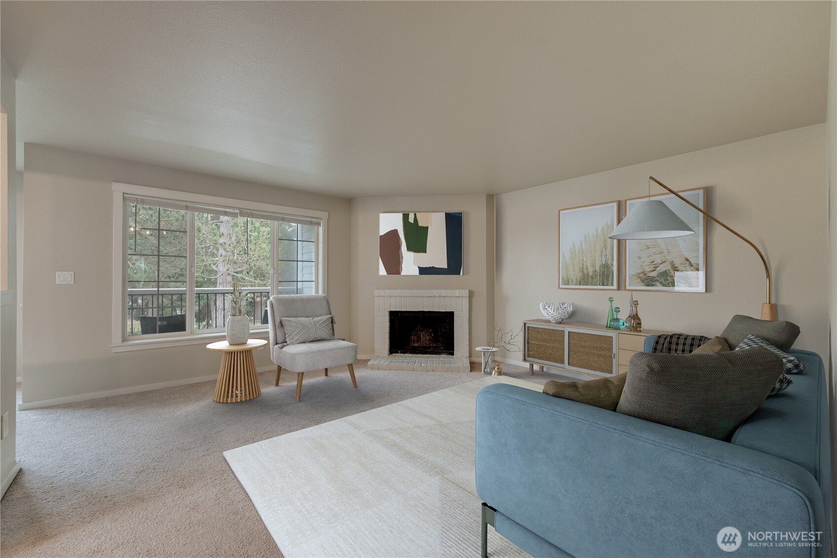 12404 East Gibson Road, Unit Q201 Everett, WA 98204 - Photo 4 of 40 a living room with furniture a fireplace and a floor to ceiling window