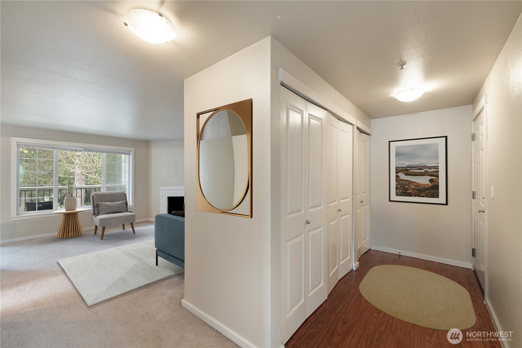 12404 East Gibson Road, Unit Q201 Everett, WA 98204 - Photo 6 of 40 a view of a livingroom with furniture wooden floor and a chandelier