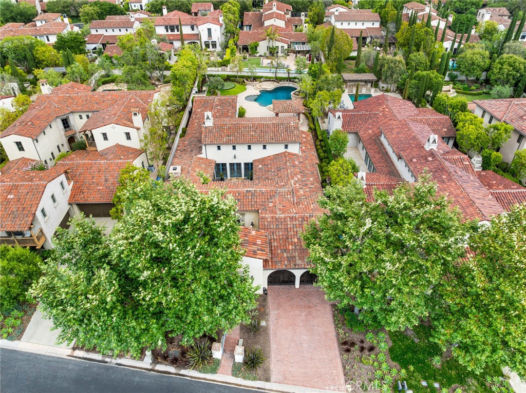 an aerial view of multiple houses with yard