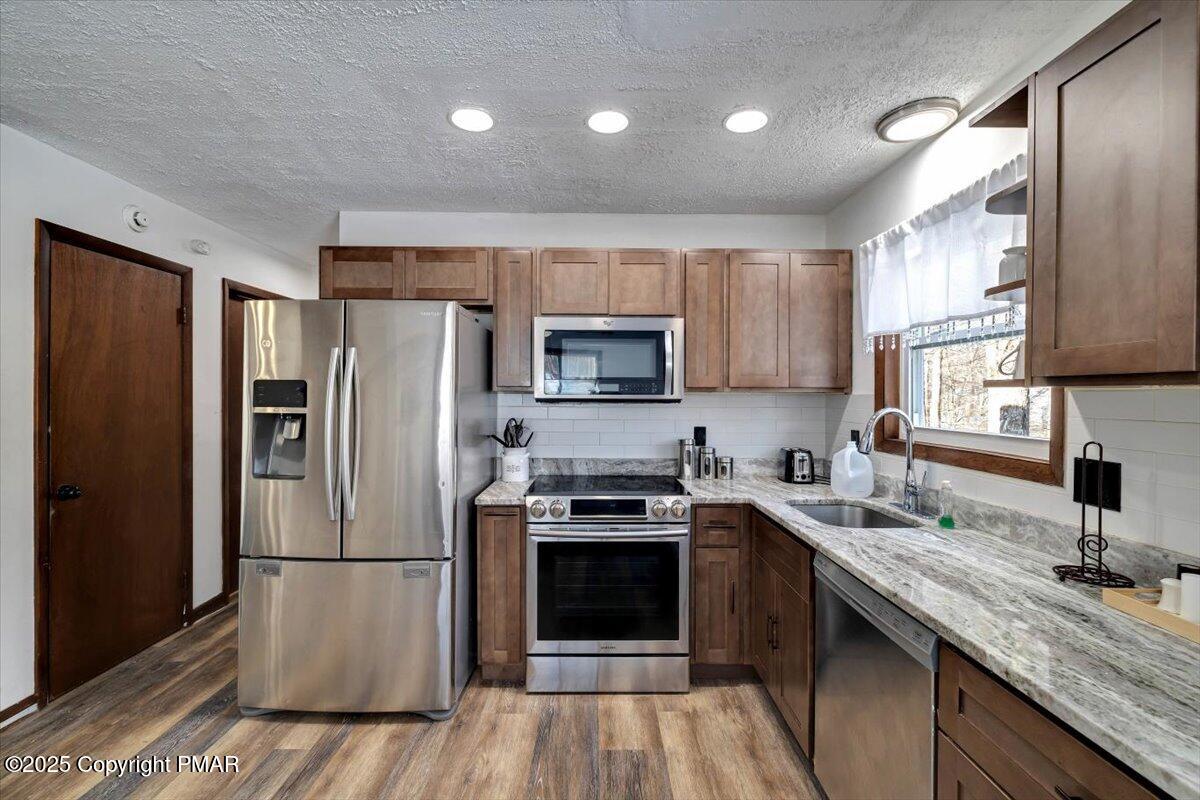 1662 Cotswald Road Tobyhanna, PA 18466 - Photo 13 of 43 a kitchen with a refrigerator sink and microwave