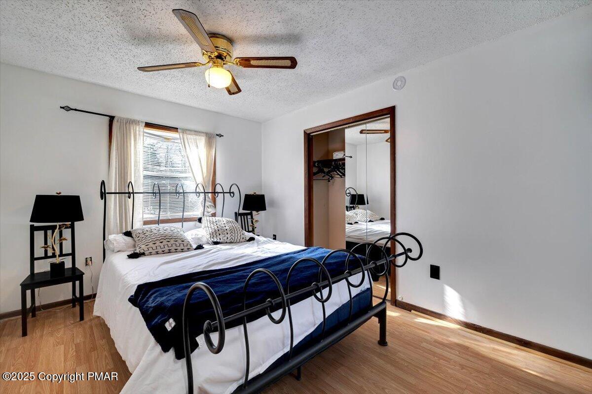 1662 Cotswald Road Tobyhanna, PA 18466 - Photo 17 of 43 a bedroom with a bed and a table in it