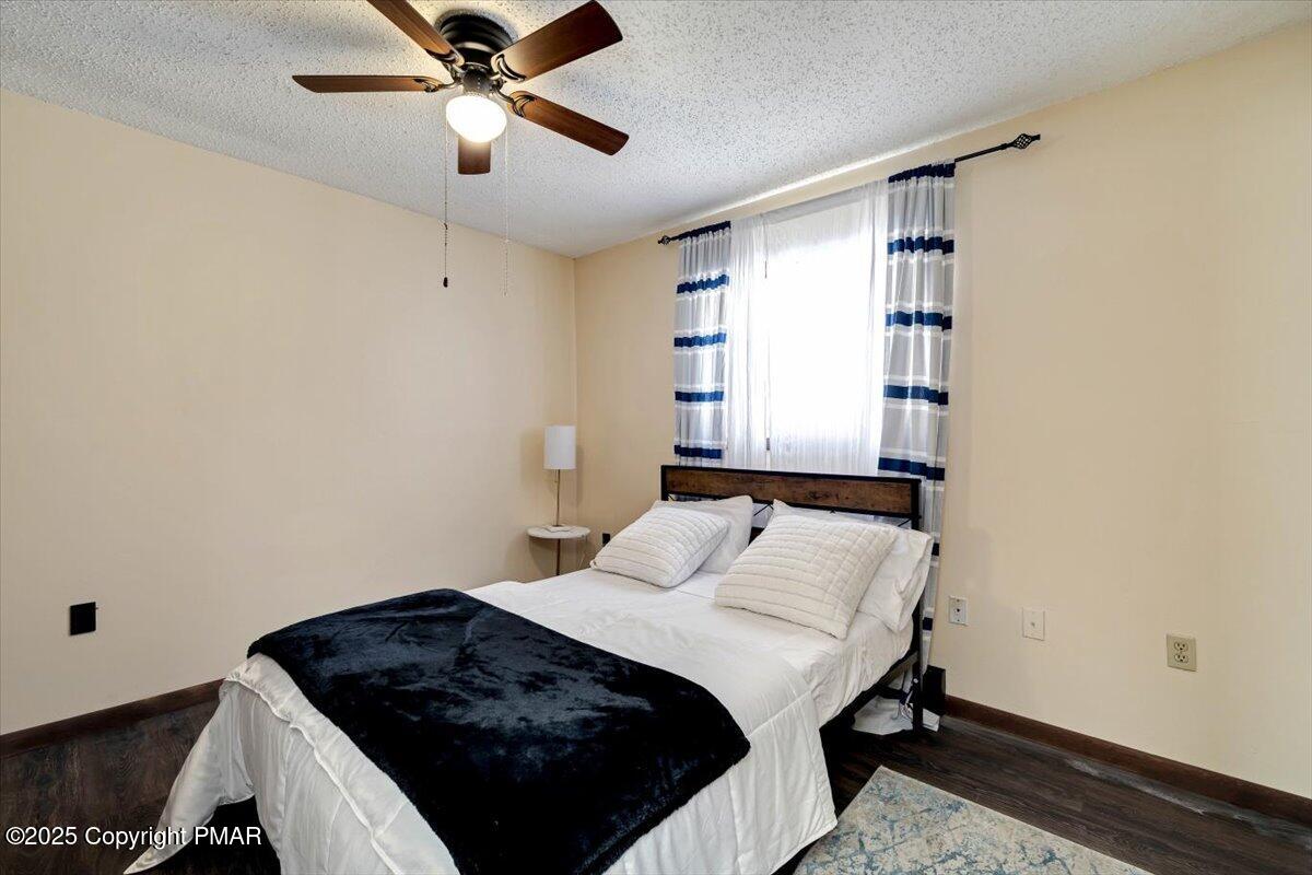 1662 Cotswald Road Tobyhanna, PA 18466 - Photo 24 of 43 a bedroom with a bed and a window
