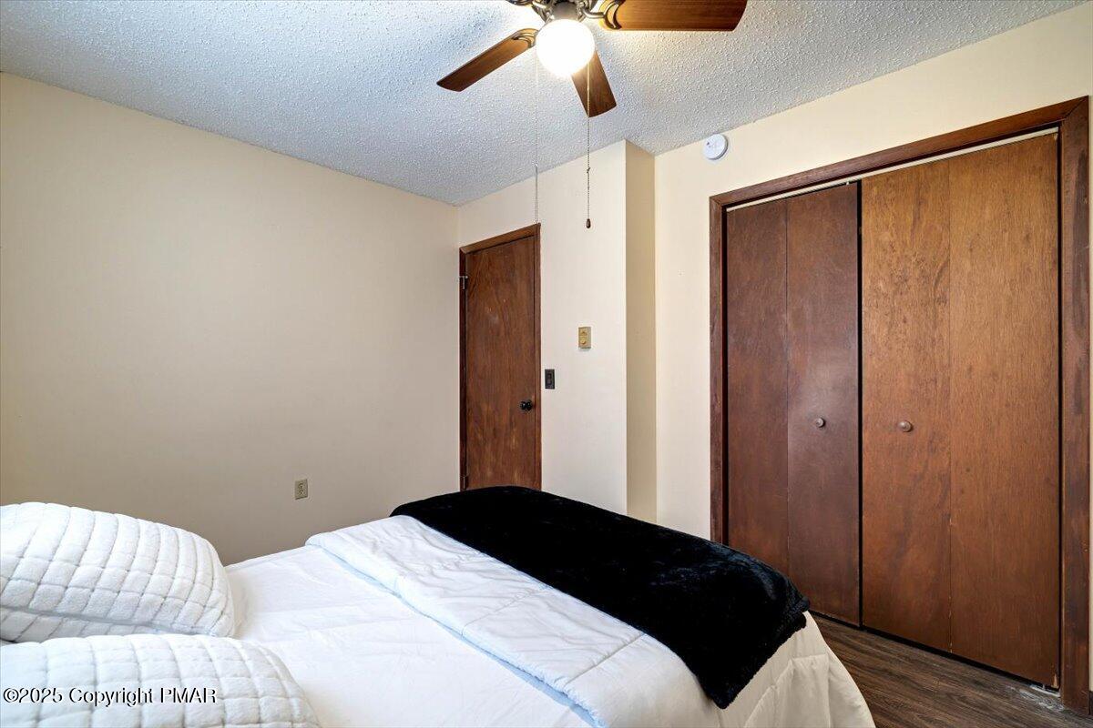 1662 Cotswald Road Tobyhanna, PA 18466 - Photo 25 of 43 a bedroom with a bed and a chandelier