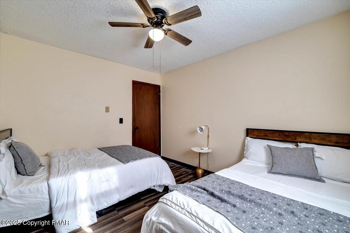 1662 Cotswald Road Tobyhanna, PA 18466 - Photo 27 of 43 a bedroom with two beds and ceiling fan