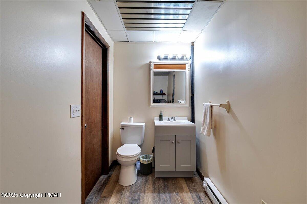1662 Cotswald Road Tobyhanna, PA 18466 - Photo 32 of 43 a bathroom with a toilet sink and mirror
