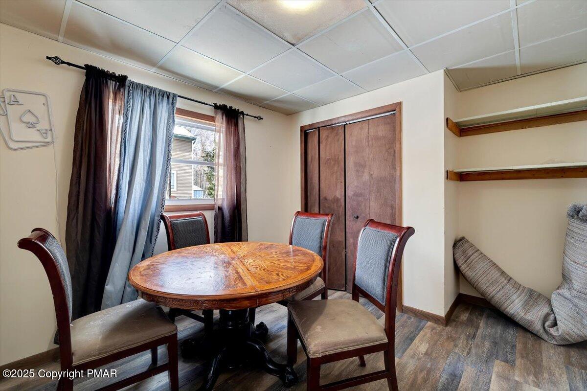 1662 Cotswald Road Tobyhanna, PA 18466 - Photo 33 of 43 a view of a dining room with furniture window and wooden floor