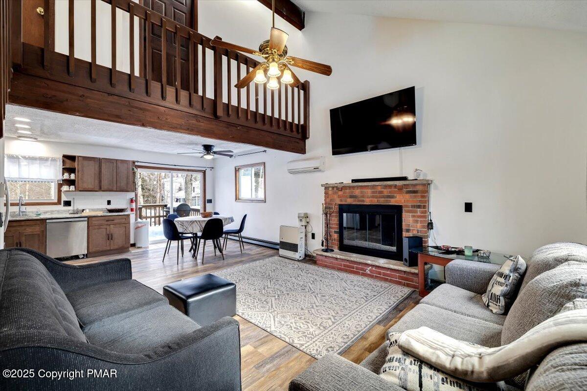 1662 Cotswald Road Tobyhanna, PA 18466 - Photo 10 of 43 a living room with furniture a flat screen tv and a fireplace