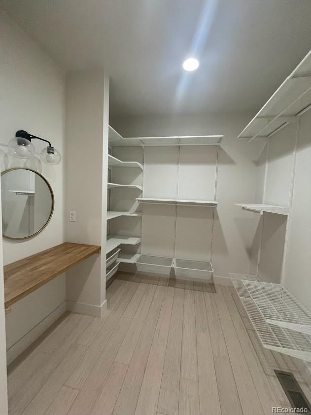 43010 Ptarmigan Rnch Street Parker, CO 80138 - Photo 11 of 15 a view of walk in closet with empty racks