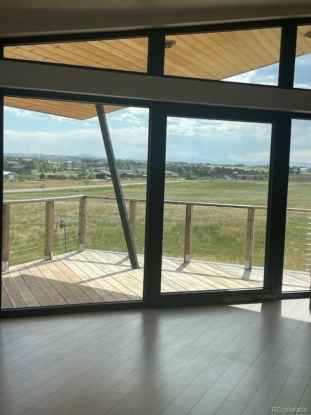 43010 Ptarmigan Rnch Street Parker, CO 80138 - Photo 15 of 15 a view of a room with wooden floor and a large window
