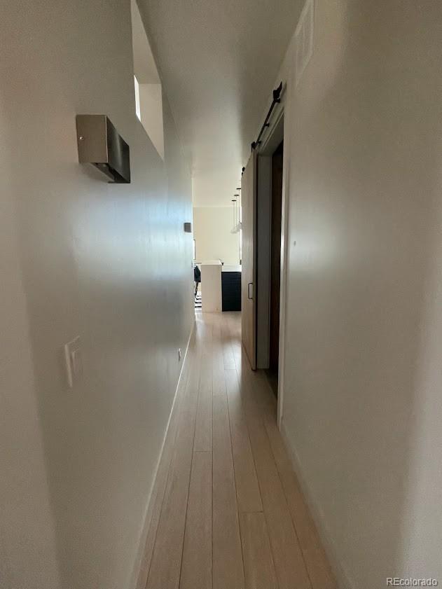 43010 Ptarmigan Rnch Street Parker, CO 80138 - Photo 3 of 15 a view of hallway with wooden floor