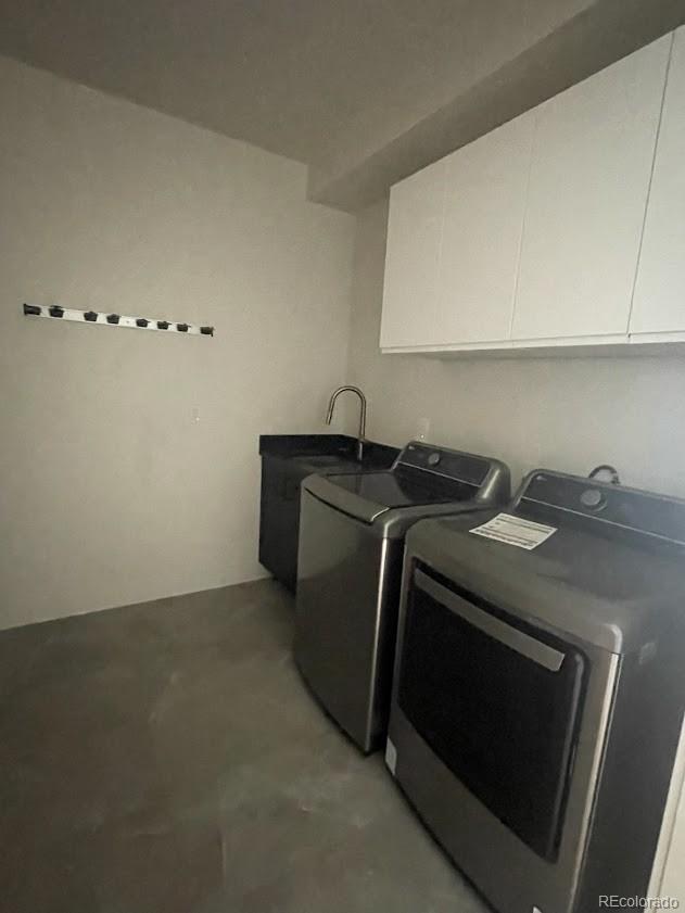 43010 Ptarmigan Rnch Street Parker, CO 80138 - Photo 4 of 15 a utility room with sink dryer and washer
