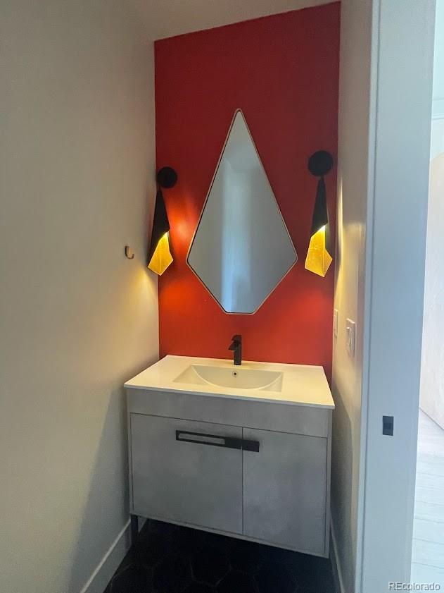 43010 Ptarmigan Rnch Street Parker, CO 80138 - Photo 5 of 15 a bathroom with a sink and a mirror