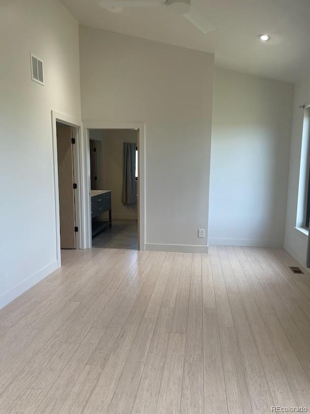 43010 Ptarmigan Rnch Street Parker, CO 80138 - Photo 7 of 15 an empty room with wooden floor and windows