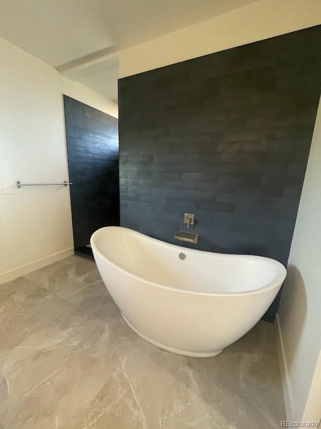 43010 Ptarmigan Rnch Street Parker, CO 80138 - Photo 8 of 15 a view of a bathtub in a bathroom