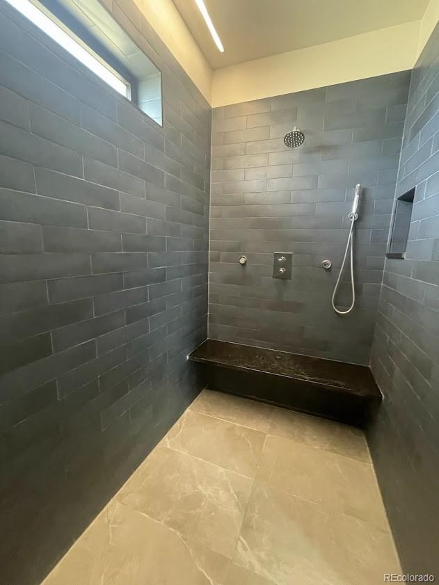 43010 Ptarmigan Rnch Street Parker, CO 80138 - Photo 10 of 15 a bathroom with a granite countertop shower