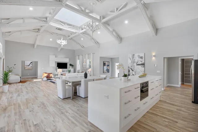 a bedroom with furniture and wooden floor
