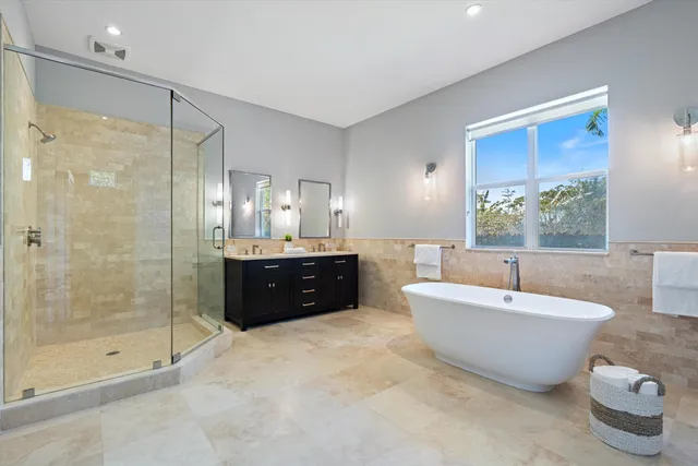 a view of a house with backyard porch and sitting area