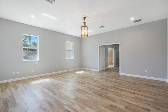 a view of a dining room with furniture and window