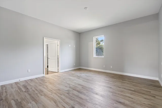an aerial view of a house having patio with a garden