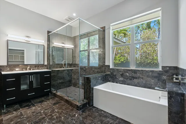 a view of a swimming pool with a bench and trees