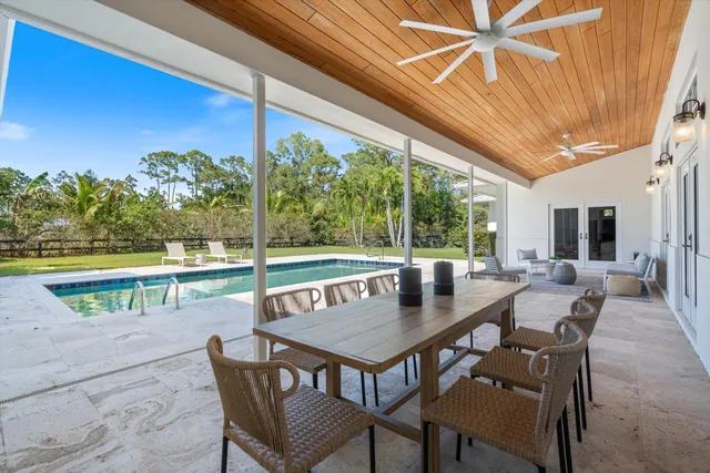 a view of a house with wooden floor roof deck