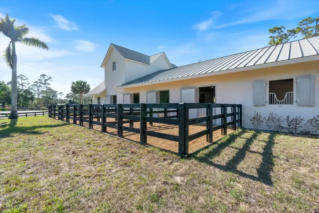 a kitchen with stainless steel appliances granite countertop a refrigerator sink and stove
