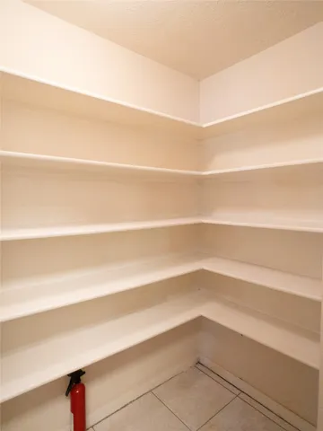 a view of a bathroom from a corridor