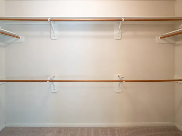 an empty room with closet area