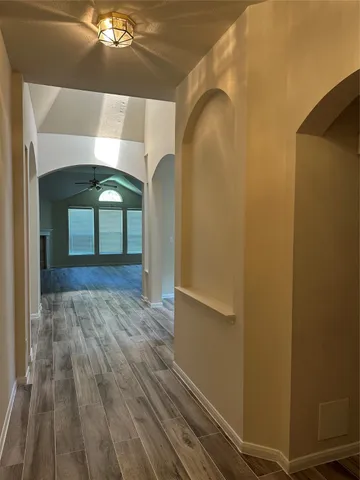 a kitchen with a stove a sink and a refrigerator