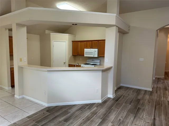 a bathroom with a tub and shower