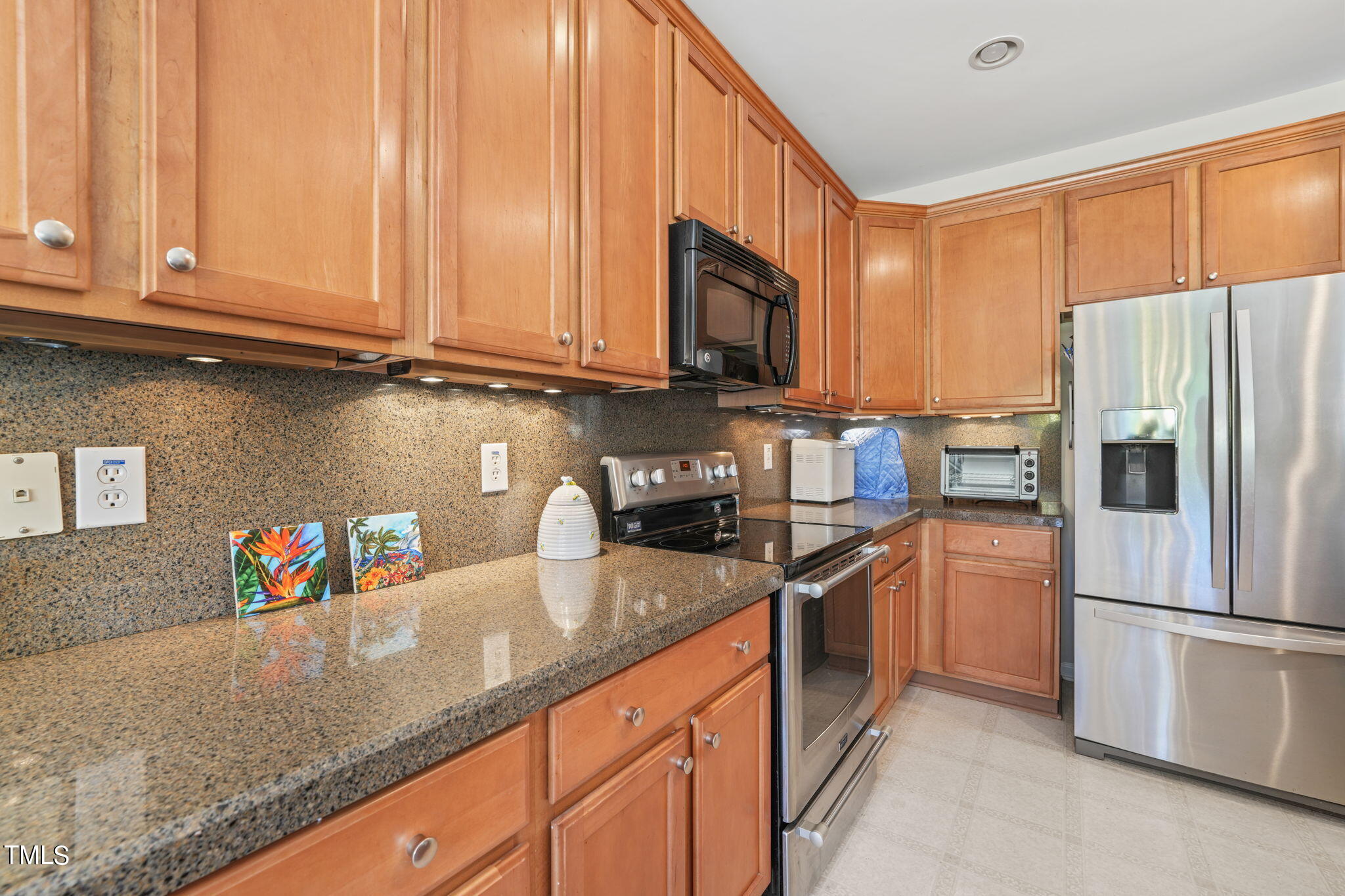 3509 Weir Way Raleigh, NC 27616 - Photo 4 of 52 a kitchen with stainless steel appliances granite countertop a refrigerator sink and stove