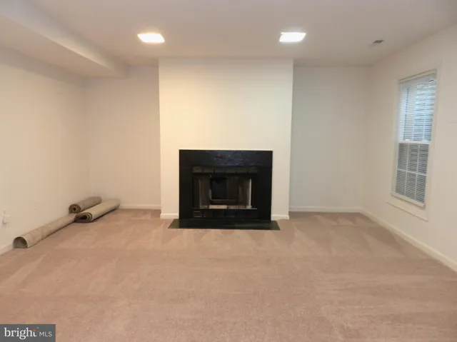 an empty room with a fireplace