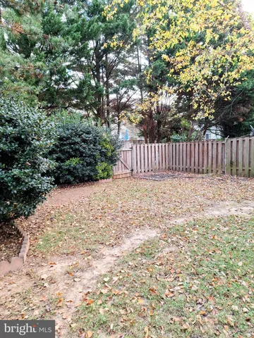 a view of balcony with a yard