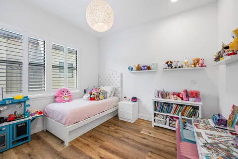 a workspace with furniture toys and a book shelf