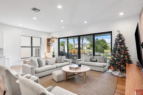 a living room with furniture and a large window
