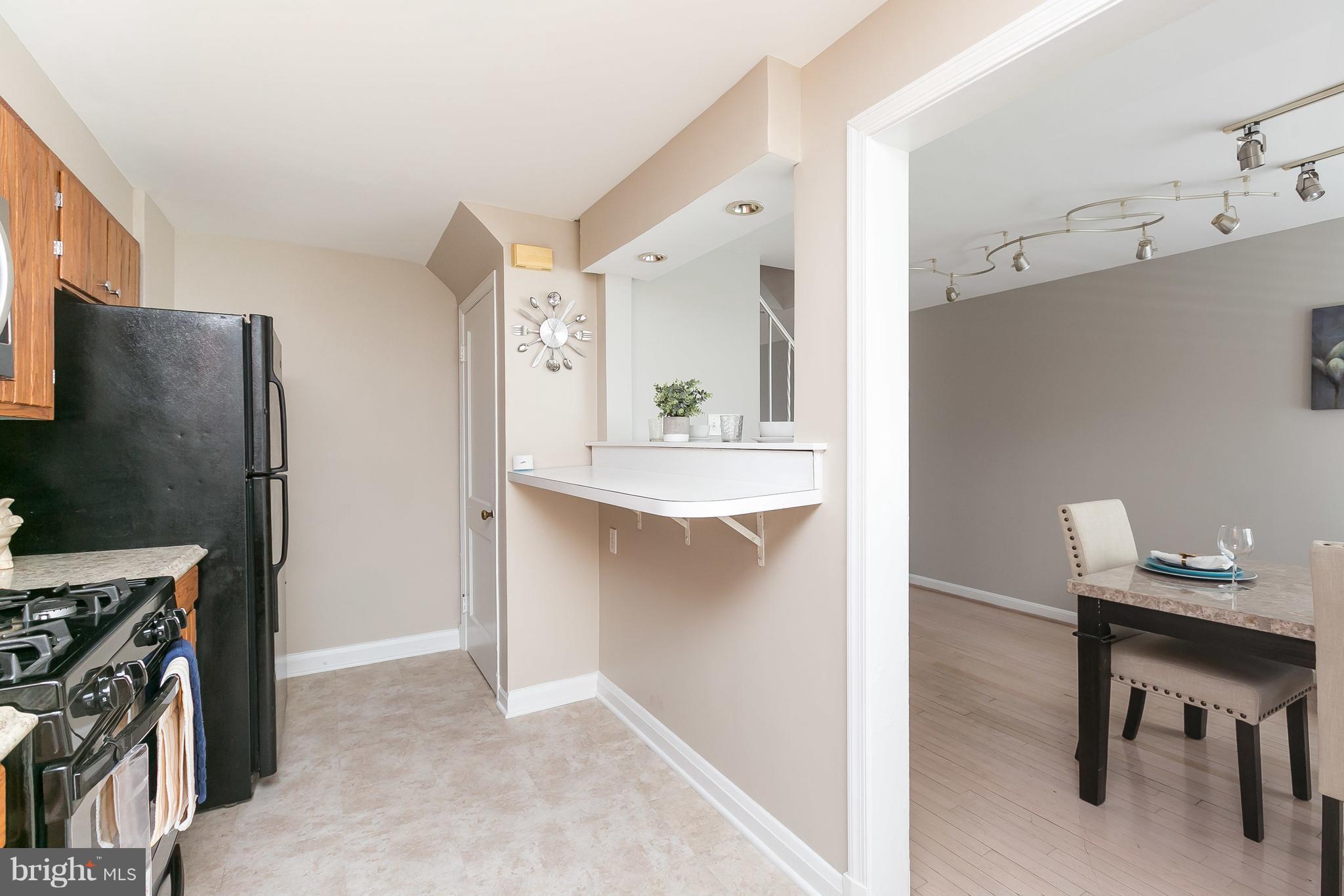 1504 Clairidge Road Baltimore, MD 21207 - Photo 13 of 30 a view of kitchen with furniture and wooden floor