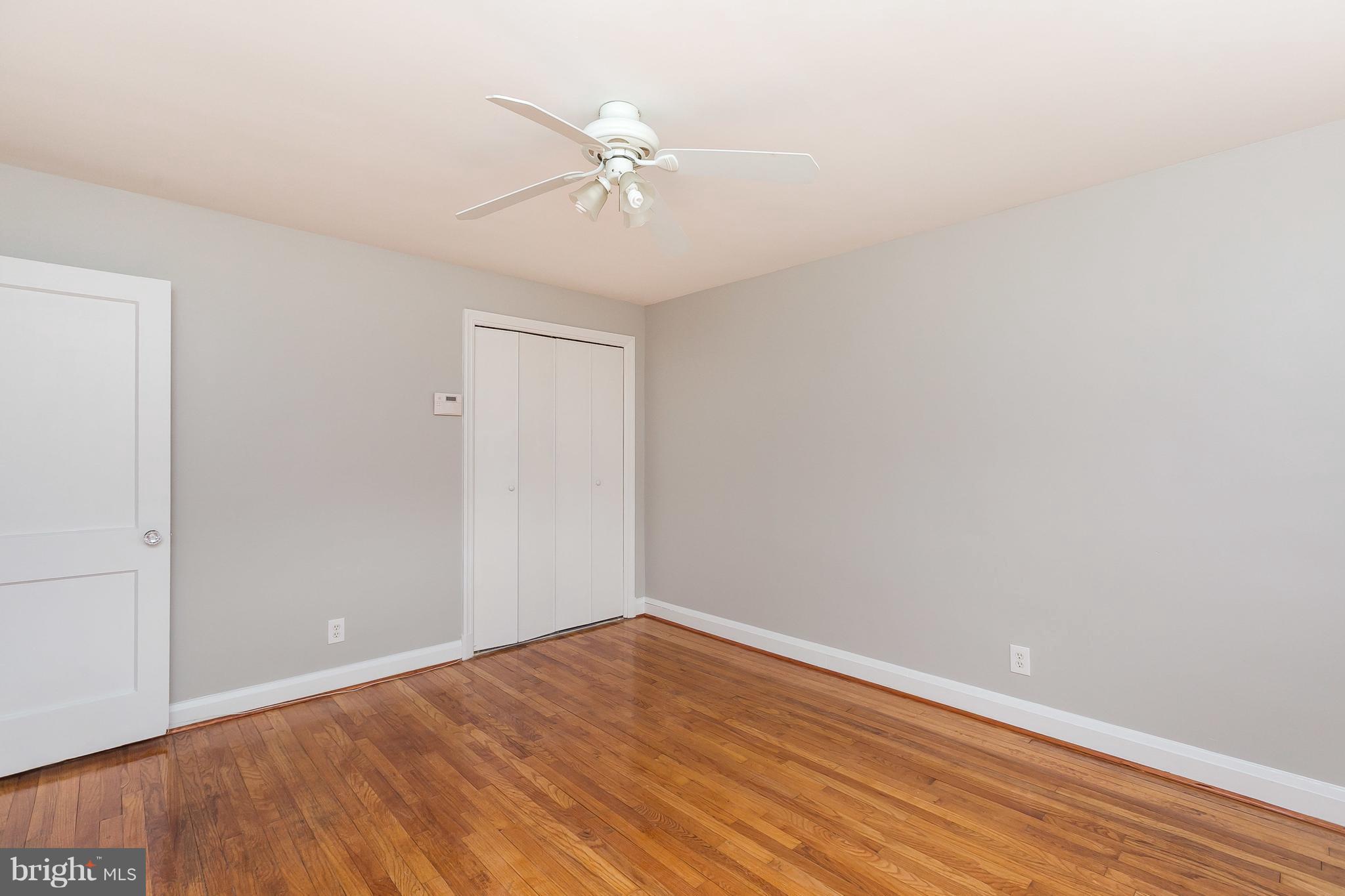 1504 Clairidge Road Baltimore, MD 21207 - Photo 14 of 30 a view of an empty room with wooden floor