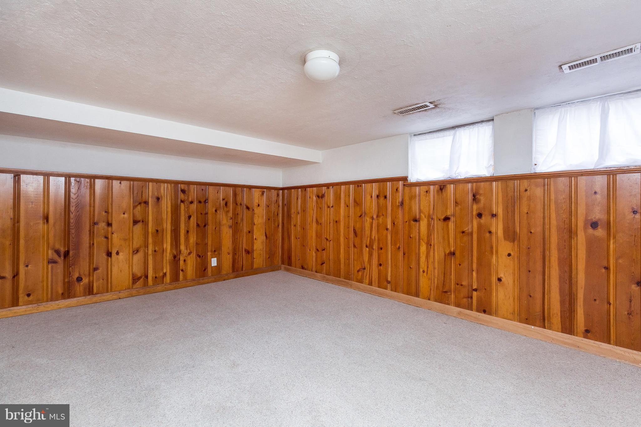 1504 Clairidge Road Baltimore, MD 21207 - Photo 22 of 30 a view of an empty room with a window