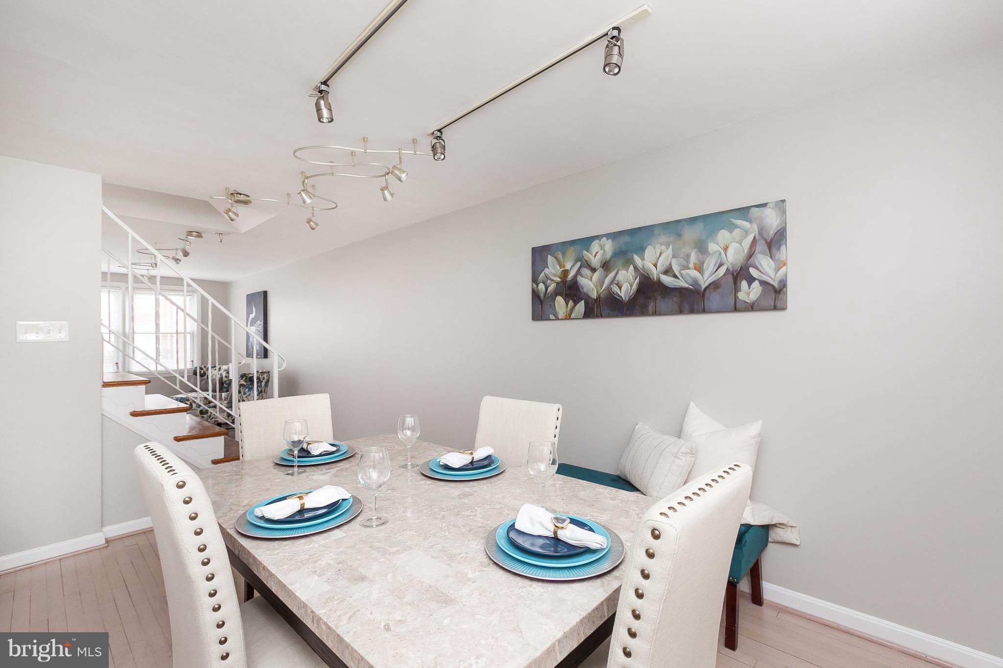 1504 Clairidge Road Baltimore, MD 21207 - Photo 6 of 30 a view of a dining room with furniture and wooden floor