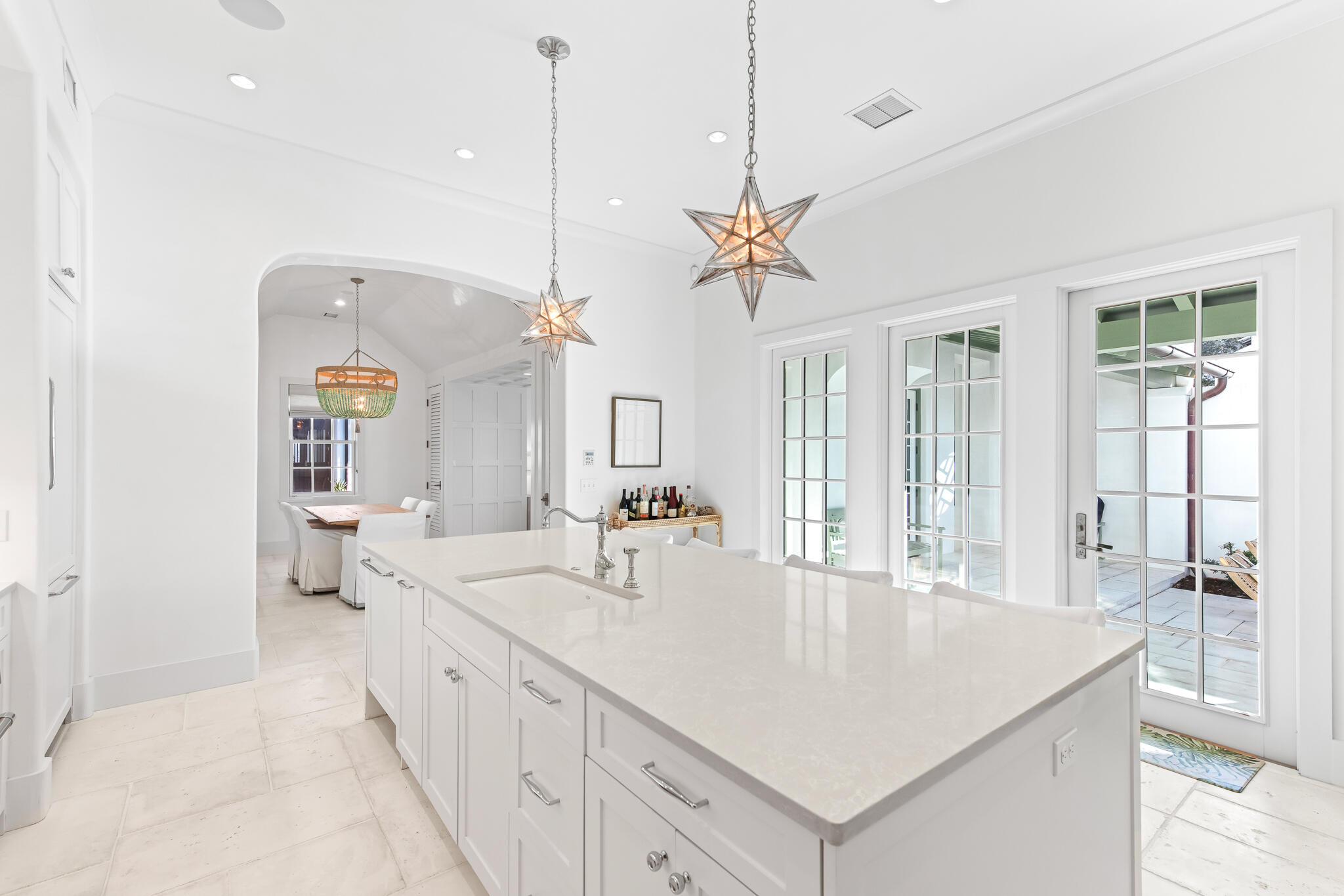 31 North Charles St Inlet Beach Inlet Beach, FL 32461 - Photo 17 of 47 a large kitchen with kitchen island a large center island and a chandelier