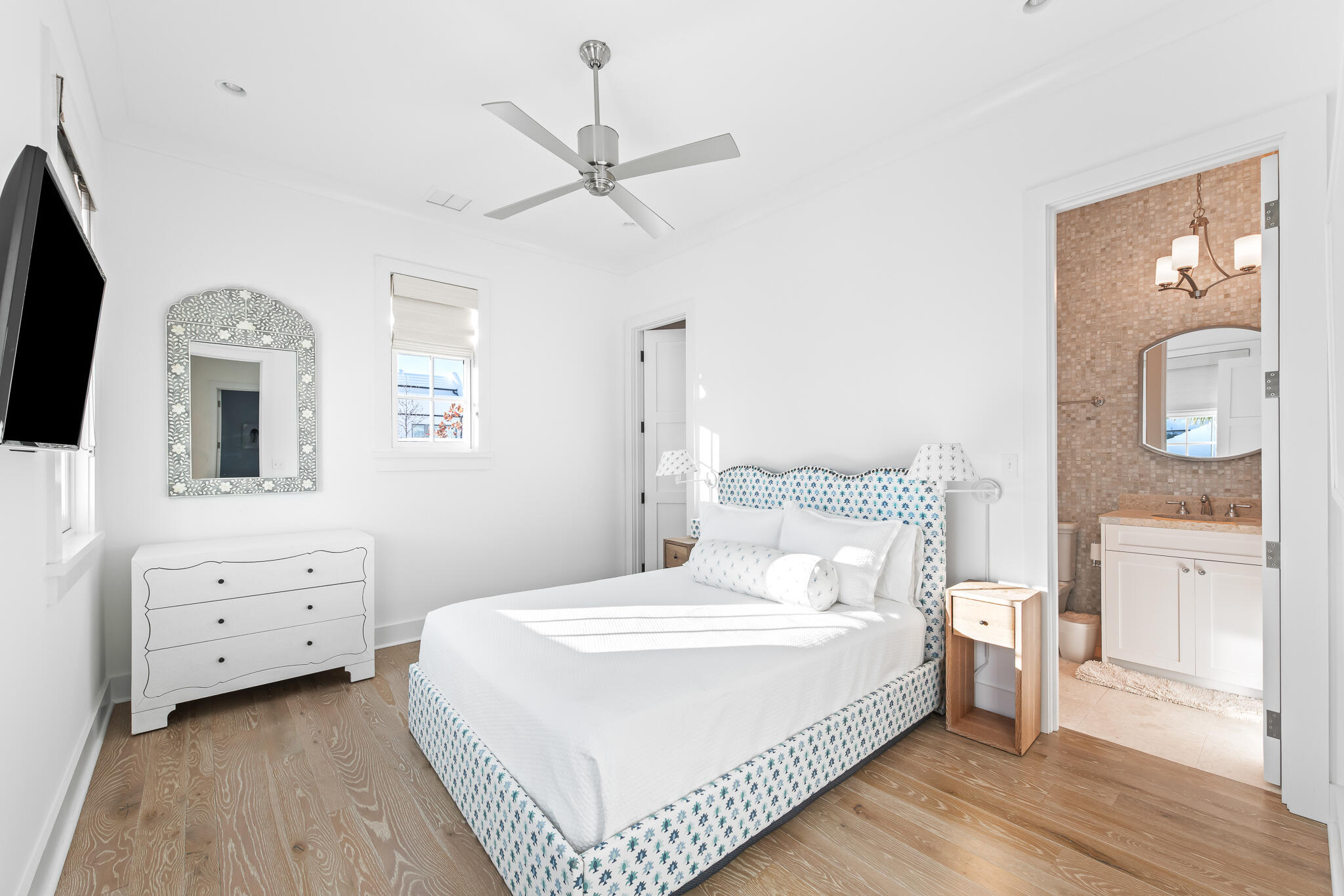 31 North Charles St Inlet Beach Inlet Beach, FL 32461 - Photo 34 of 47 a bedroom with a bed a mirror on the wall and dresser