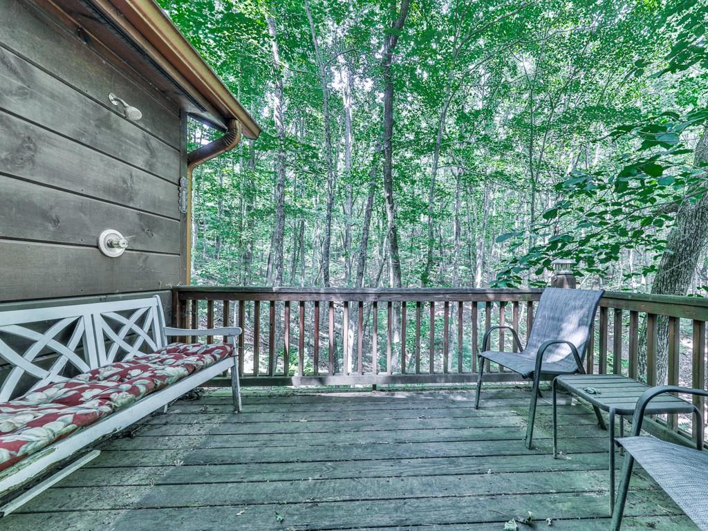 189 Smith Hill Road Blue Ridge, GA 30513 - Photo 22 of 29 a view of balcony with wooden floor and outdoor seating