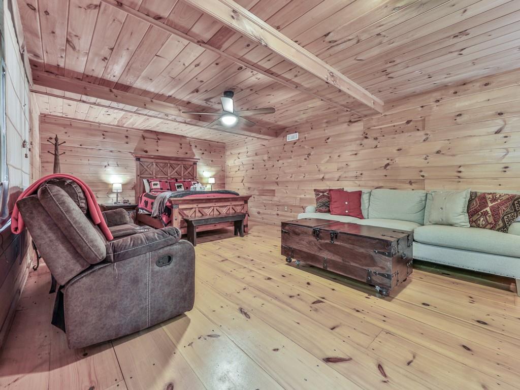 189 Smith Hill Road Blue Ridge, GA 30513 - Photo 25 of 29 a living room with furniture and a wooden floor